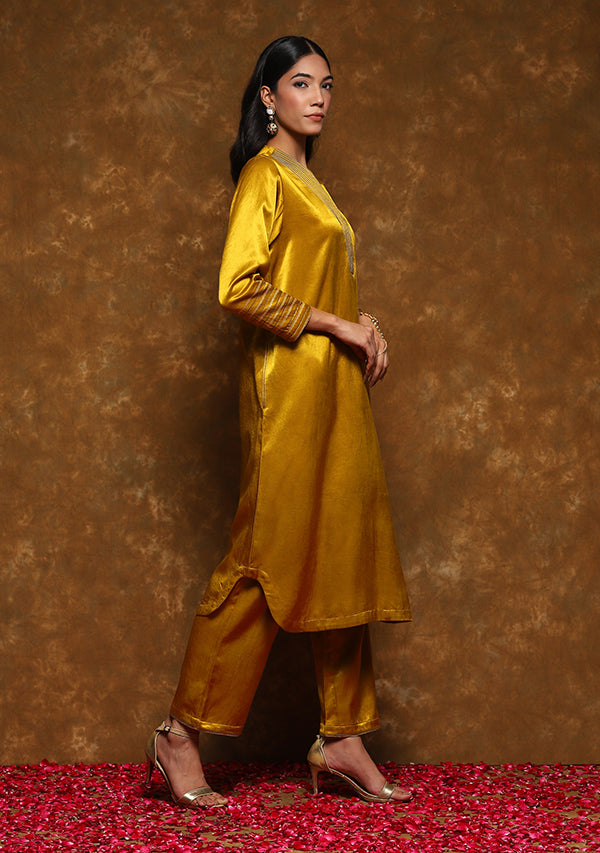 Mustard Mushru Kurta with Gold Trimmings paired with Pants